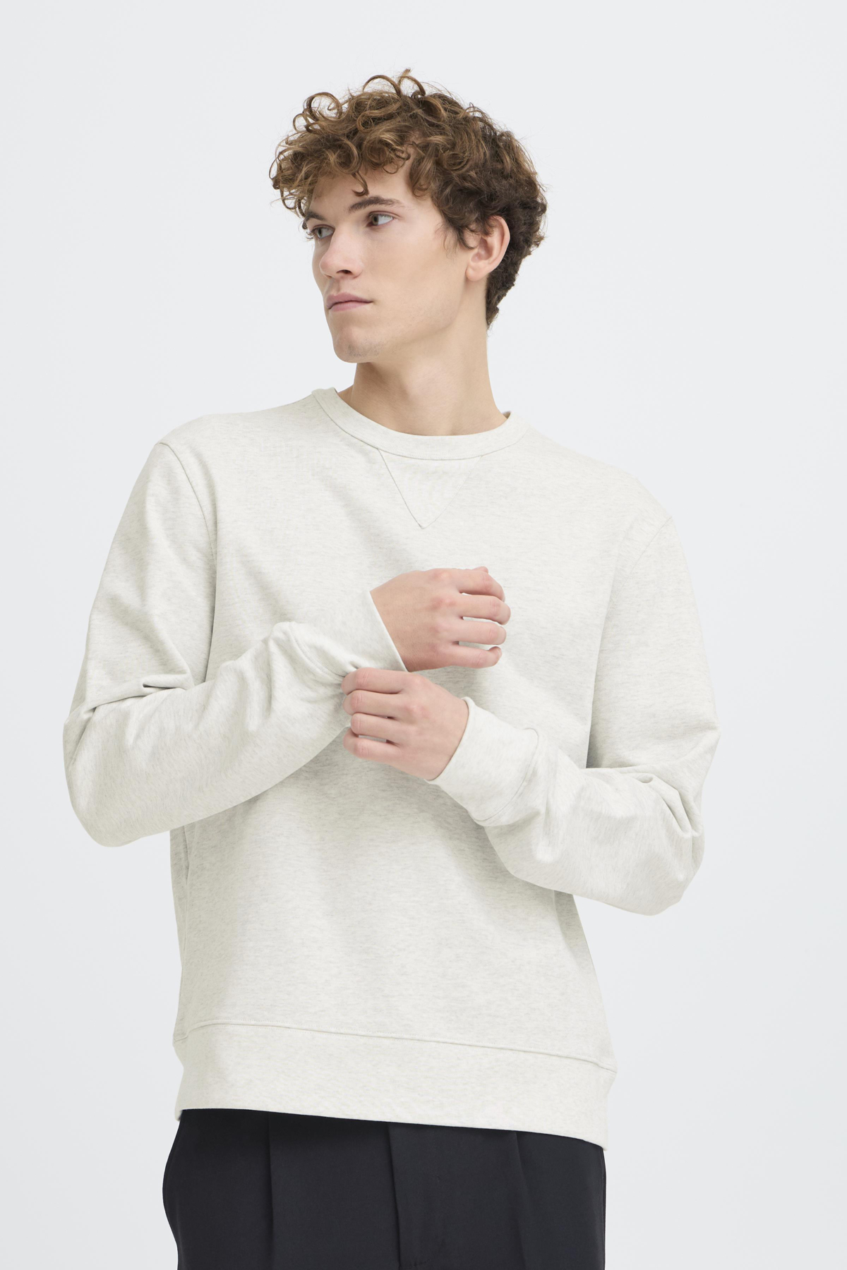 mens light grey sweatshirt crew neck relaxed fit close up minimalist style