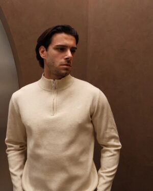 Men’s beige quarter zip jumper on model in smart casual outfit