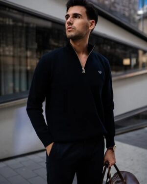 Men’s navy quarter zip jumper on model in smart casual outfit