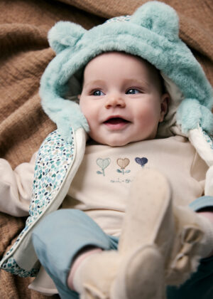 Baby girl wearing the Mayoral Newborn 3-Piece Tracksuit and Gilet in Green Multi