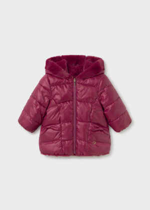 Girls’ reversible raspberry pink padded puffer jacket with a plush faux fur-lined hood, quilted design, long sleeves and front zip fastening.