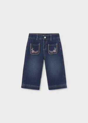 Girls’ blue wide-leg denim jeans with two front patch pockets decorated with pink and purple floral embroidery, button fastening, belt loops and contrast stitching.