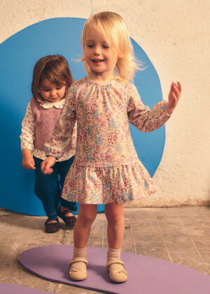 Baby girl wearing the Mayoral printed dress in mauve.