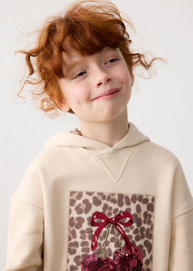 Close-up of the Mayoral girls’ cream sweatshirt dress and hood